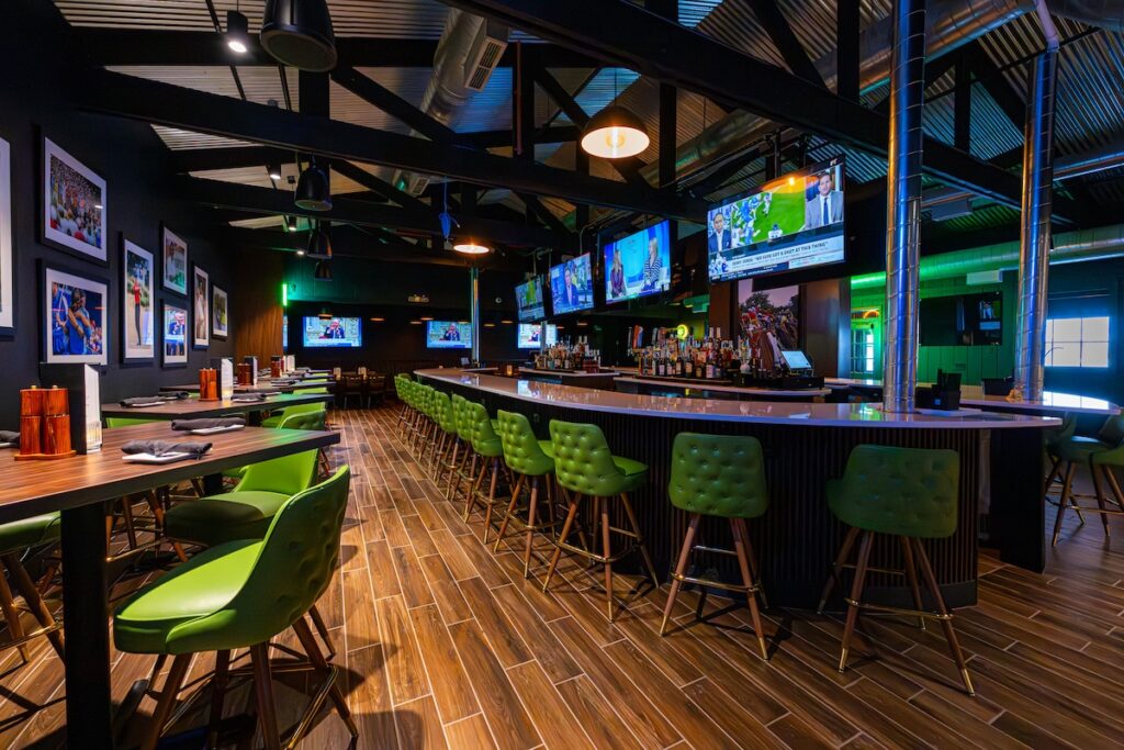 a row of tables and the bar top at the ParT Barn